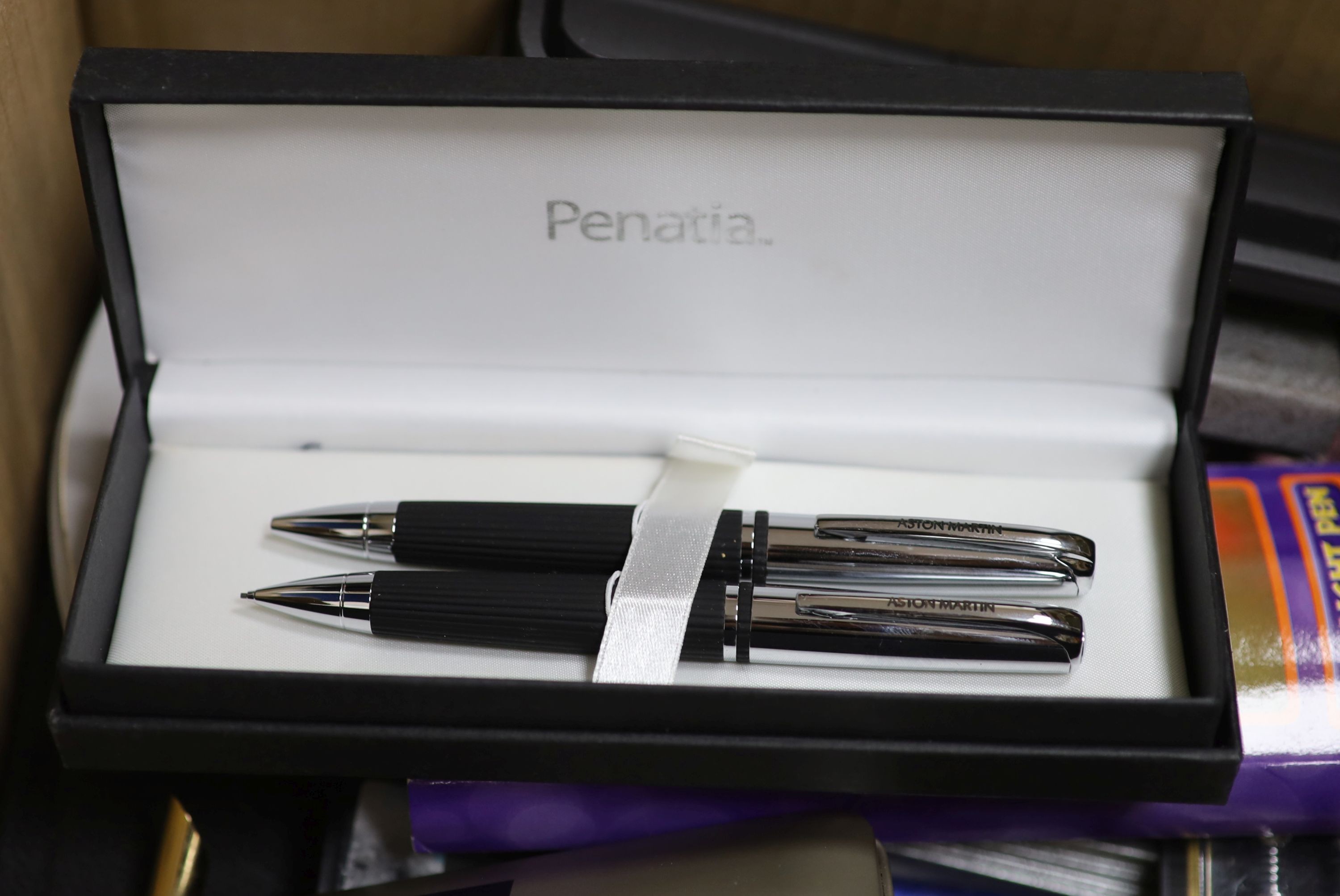 A large collection of pens and pencils, etc.